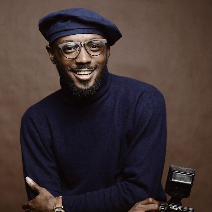 Avery Chen, Lead Design Curator at CalmOriginRoute, reviewing corporate floral arrangements